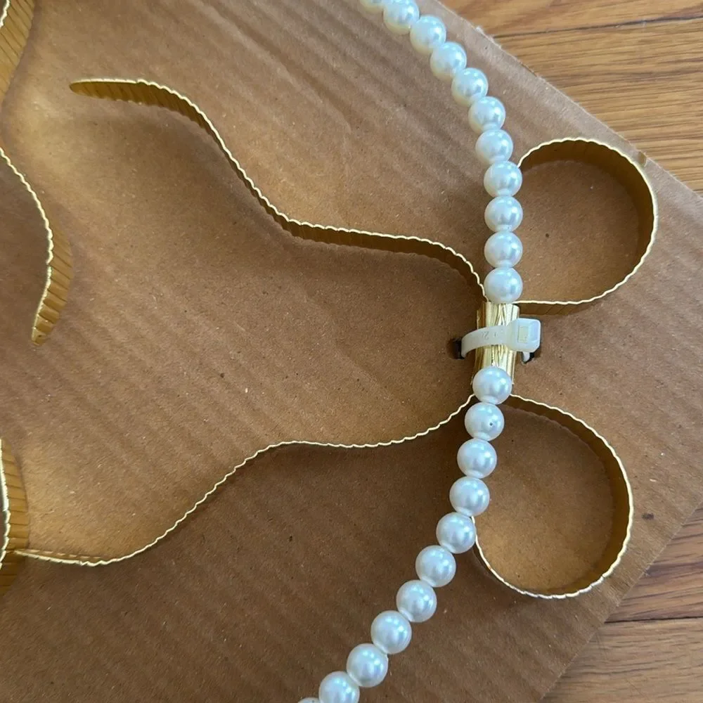 Eloise Pearl & Bow Banner from Urban Outfitters Outfit Your Dorm Back to School